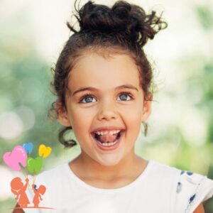 Little girl smiling, showing her baby teeth.