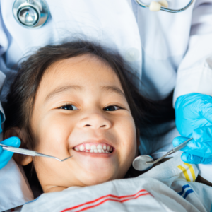 Little girl smiling in dental chair